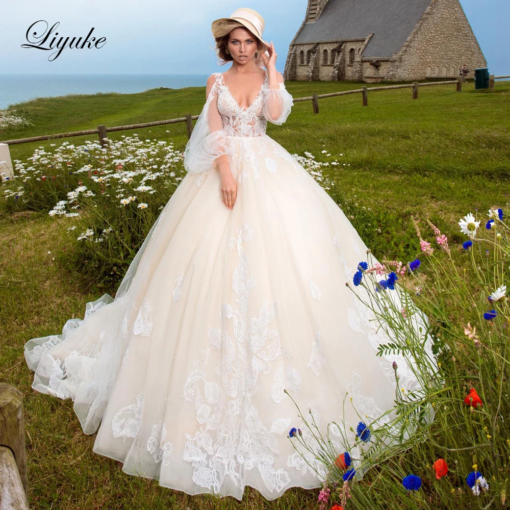 Свадебное платье Трапециевидной формы Liyuke с пышными рукавами и потрясающим кружевным свадебным платьем без спинки Изображение 0